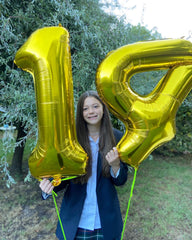 IWERP Gold Number 4 Balloon stage-center creates a celebration centerpiece and focal point.