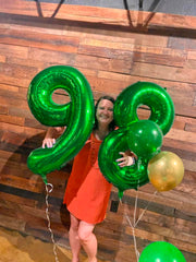 IWERP green 8th birthday foil balloon enhances party decor with a vibrant focal point.