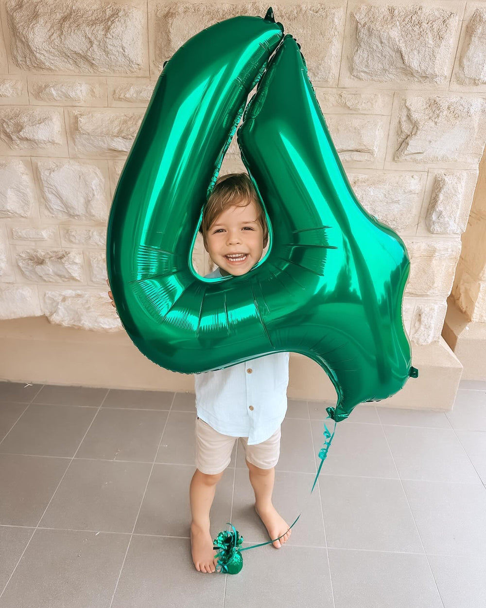 IWERP green number 4 balloon front view enhances centerpiece decor.