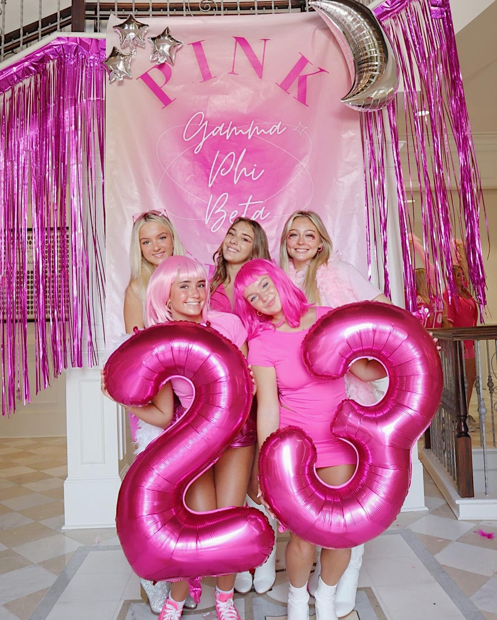 IWERP hot pink number 3 balloon backdrop enhances photos and celebrations.