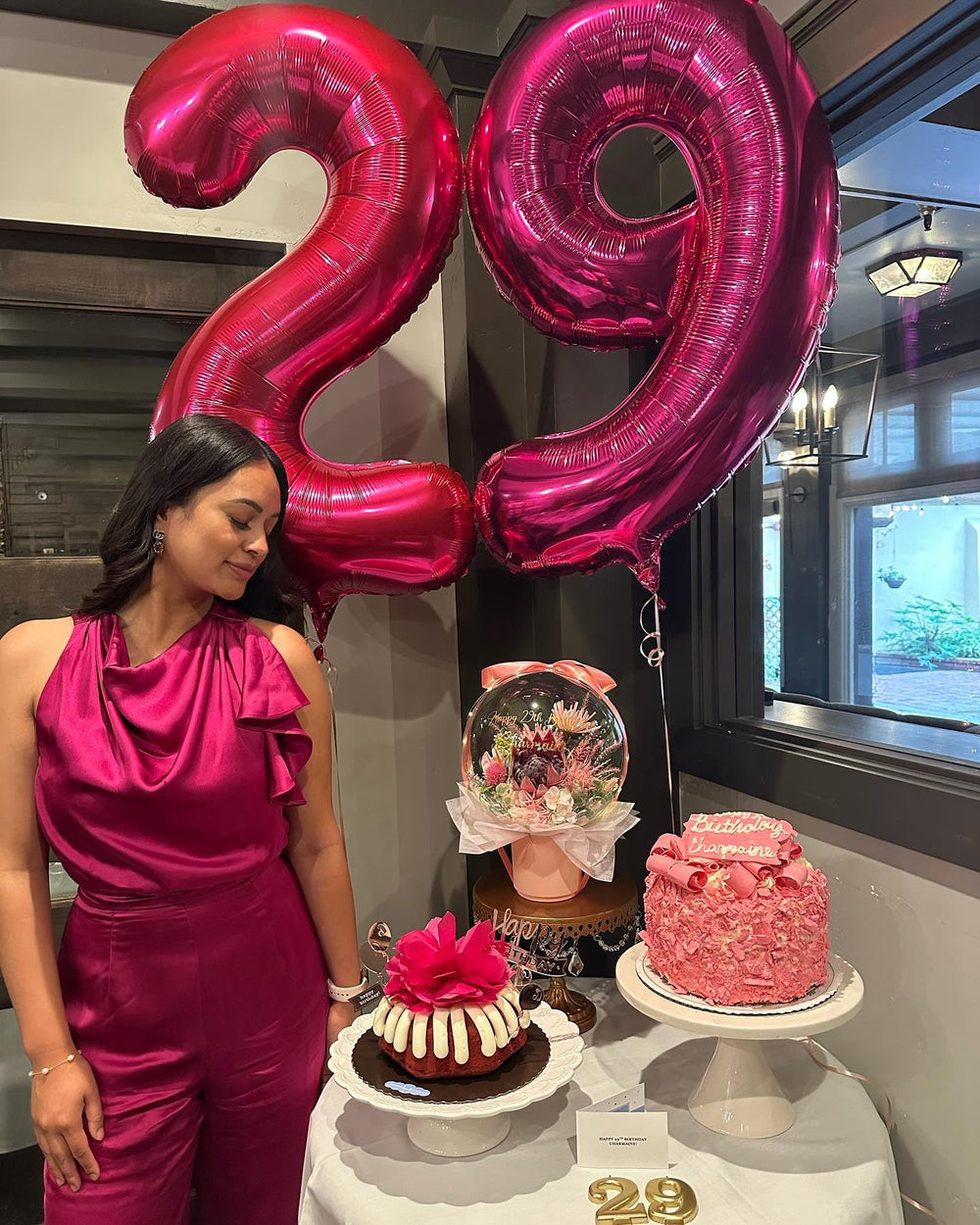IWERP hot pink number 9 balloon creates a vivid photo backdrop for celebrations