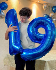 IWERP navy blue 4-balloon, 40-inch birthday decor focal point.