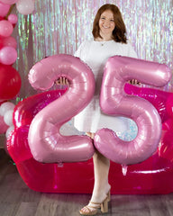 IWERP pearlescent pink number 4 balloon floats with helium for celebrations.