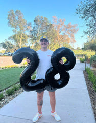 IWERP photo prop black 50th balloon for stylish milestone moments.