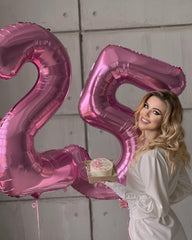 IWERP pink 4th birthday balloon stage setup adds vibrant color