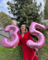 IWERP pink number 5 balloon serves as a fun photo prop for parties.
