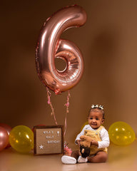 IWERP rose gold 6th birthday stage backdrop for striking photos.
