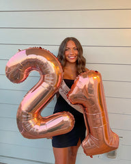 IWERP rose-gold giant birthday balloon creates memorable setups.