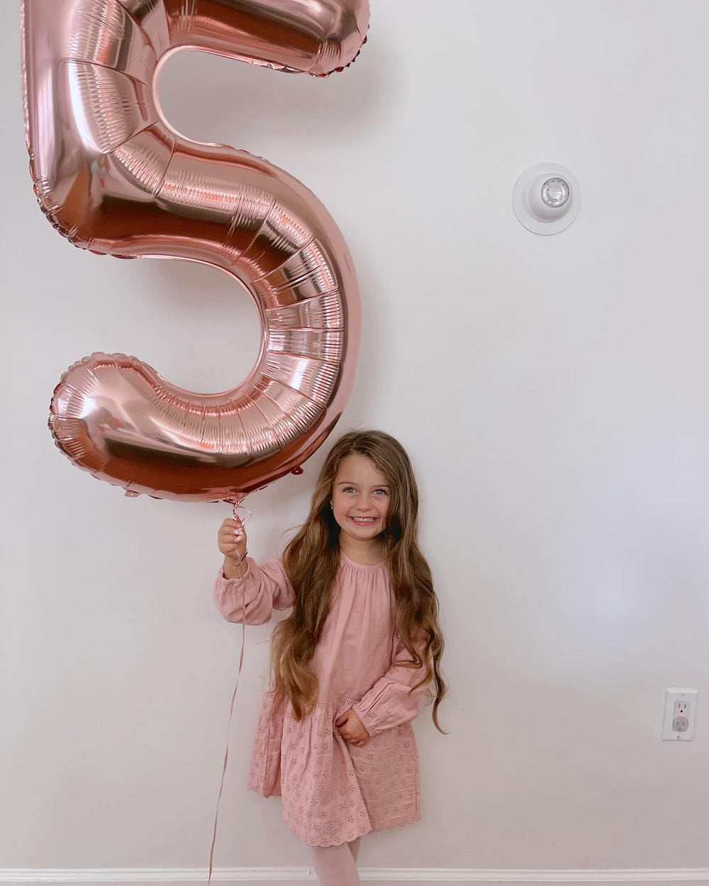 IWERP rose-gold foil number balloon stands out as a striking focal point.