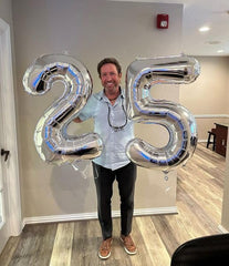 IWERP silver 25th birthday balloon with a shimmering finish for elegant decor.