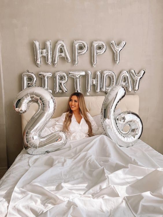 IWERP silver balloon backdrop enhances party photos and celebrations.