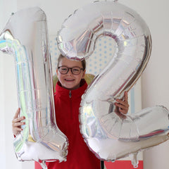 IWERP silver number balloon adds elegant finish to birthday décor.