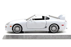 Jada Brian's Toyota Supra 1:24 side view with sleek silhouette for shelves.