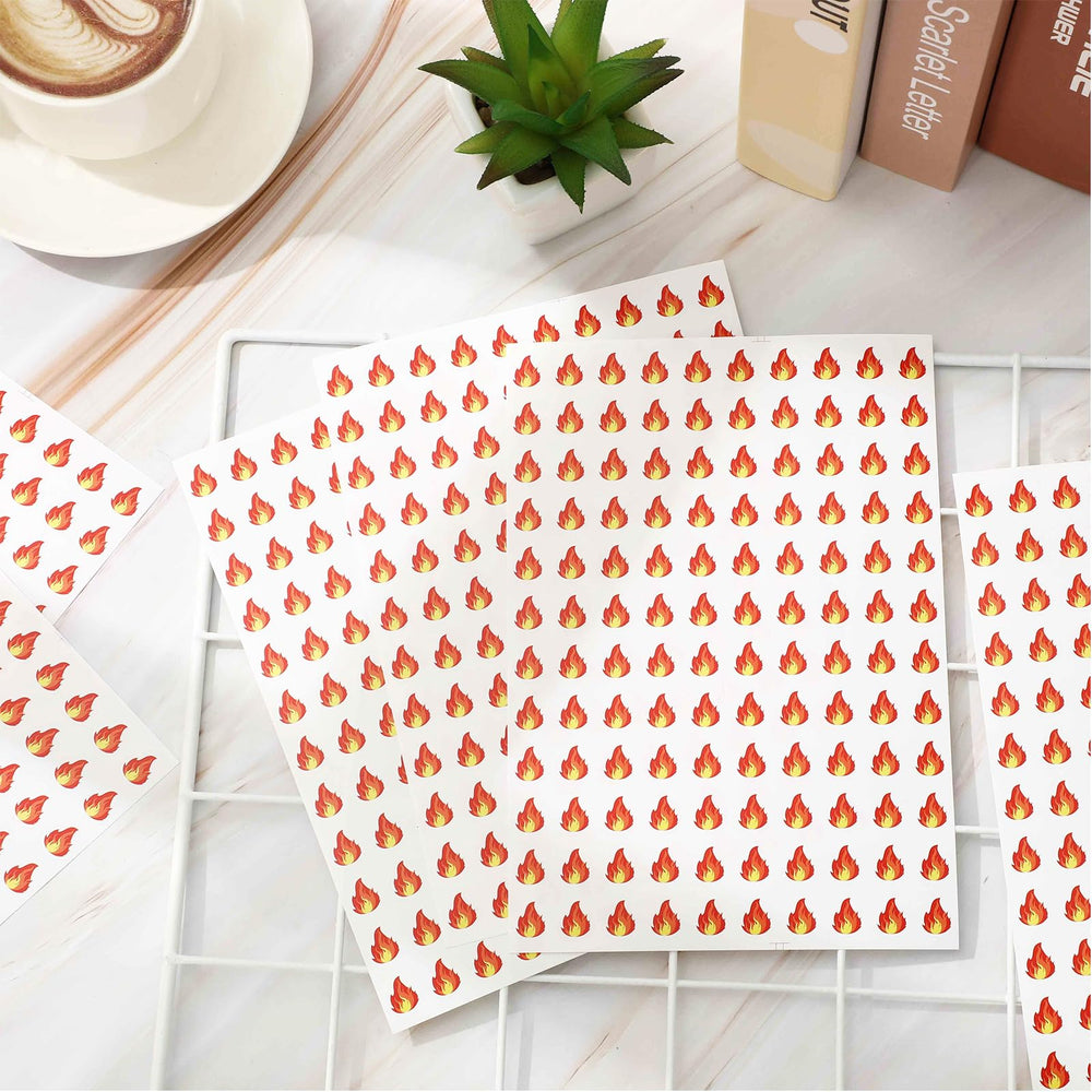 JarThenaAMCS orange fire sticker 0.5in on laptop lid for personalization