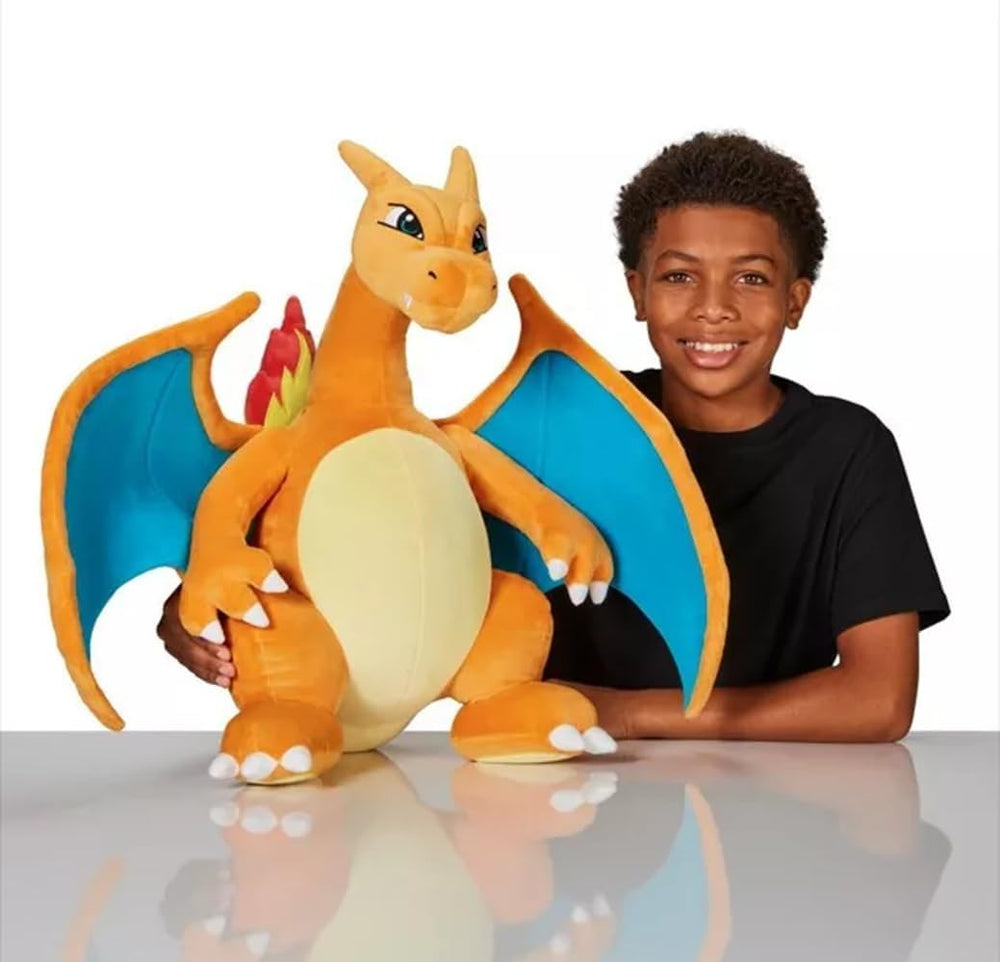 Jazwares Charizard giant plush posed with child for scale and fun.