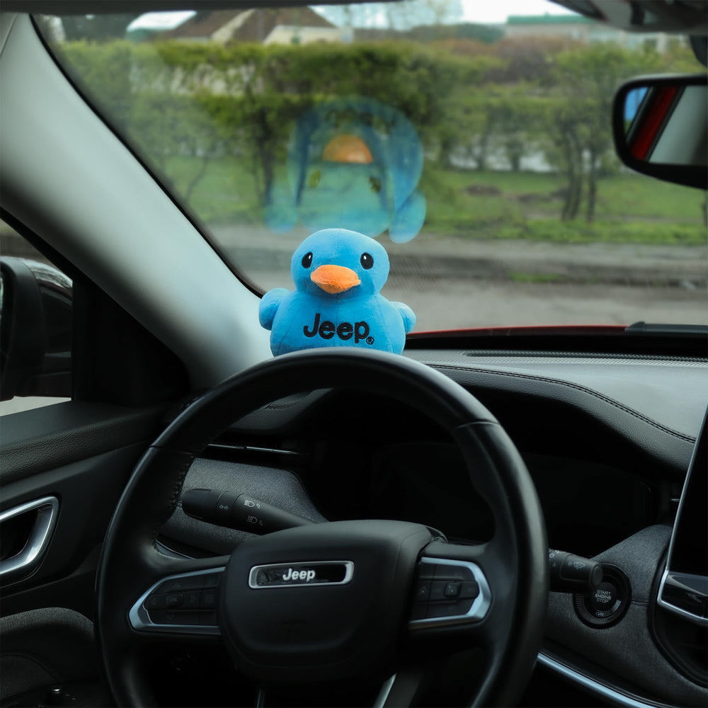 Jeep blue plush duck as part of a collector's display.