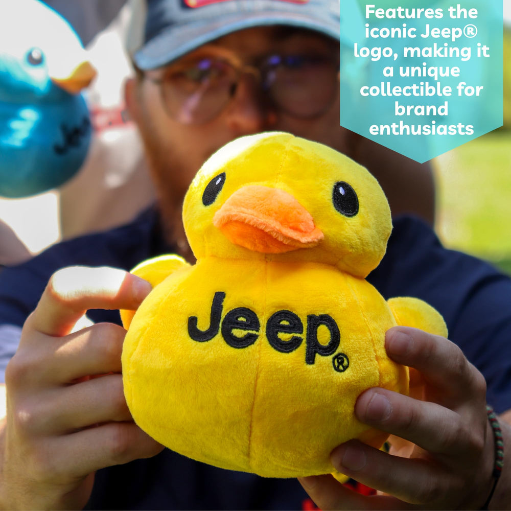 Hand-held Jeep Text Logo Duck Plush demonstrating compact, portable design.