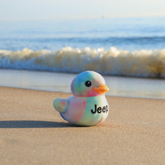 Jeep duck plush with vibrant tie-dye, ideal shelf display.