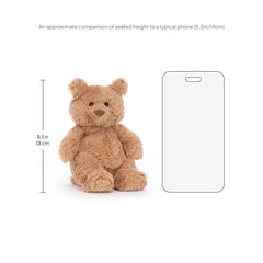 Jellycat Bartholomew Bear in a bed scene highlighting travel-friendly size.