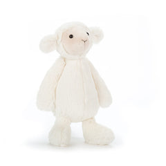 Jellycat Bashful Lamb sitting pose as a portable, huggable companion for travel