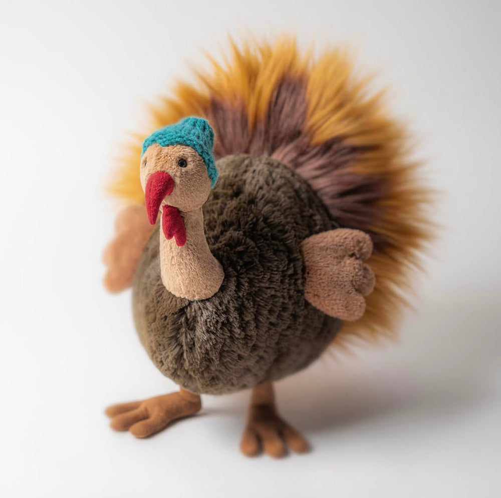 Jellycat Theo Turkey features wings and expressive face for imaginative play.