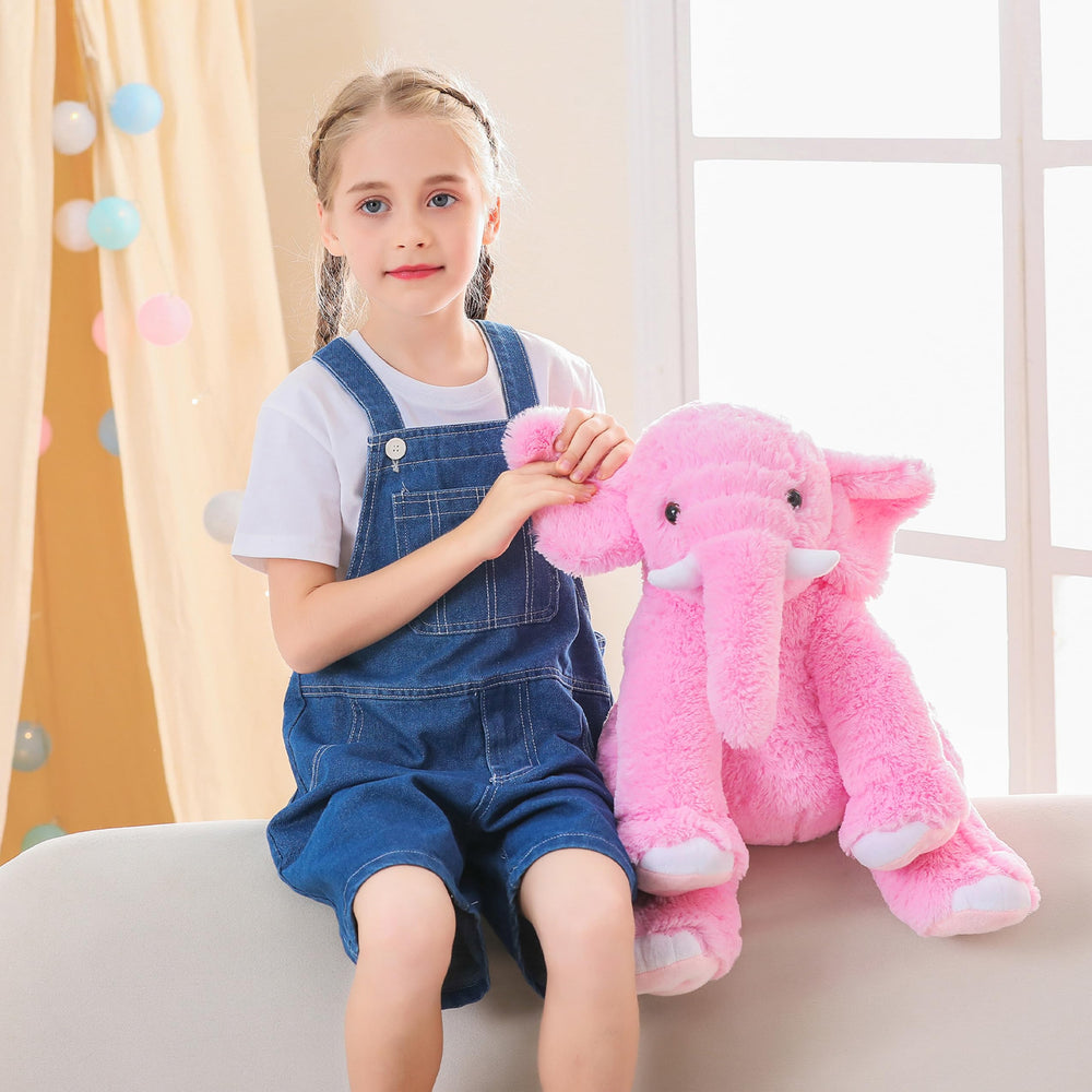 JellyMallow elephant weighted plush on bed as a comforting decor piece.