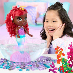 Ariel’s tail submerged in water triggers a color-changing light show and fountain-like spray.