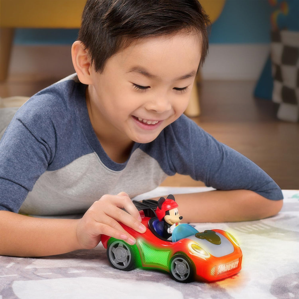 Just Play Mickey Mouse Rev 'n Glow Racer includes batteries for motorized fun.