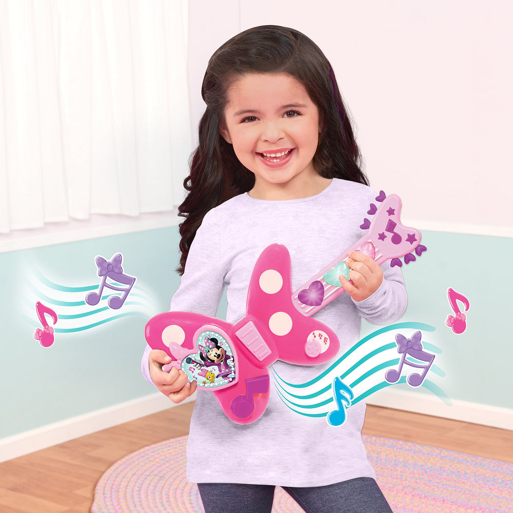 Just Play Minnie Bow-Tique Rockin' Guitar neck lights glow for music moments during pretend jams.