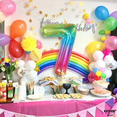 KatchOn giant-foil-number-7-rainbow balloon enhances festive party backdrops.