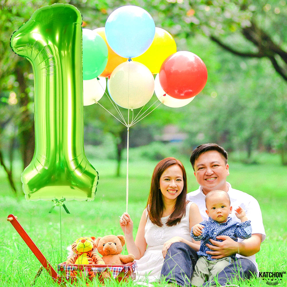 KatchOn safari and dinosaur theme decor using green number 1 balloon.