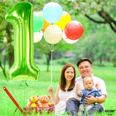 KatchOn safari and dinosaur theme decor using green number 1 balloon.
