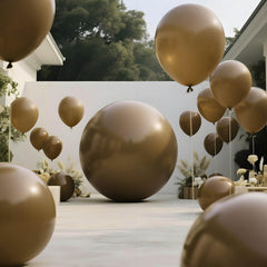 KAWKALSH brown-toned balloon wall adds depth to event decor.