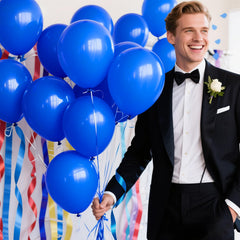 KAWKALSH balloons decorating a blue-themed birthday party arch.