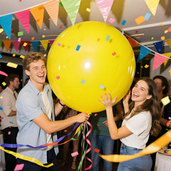 KAWKALSH safari-themed baby shower decor with yellow jumbo balloons