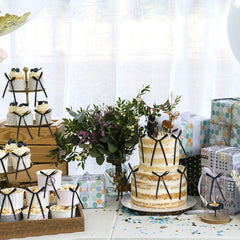 Keaziu high-footed cup decor with black bow adds height.