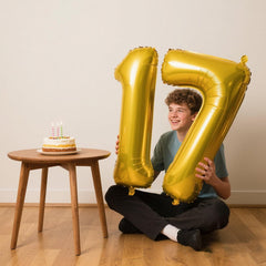 Kelfuoya 40-inch gold number 7 balloon on wall display for milestone celebrations