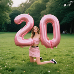 Kelfuoya pearlescent pink number 20 balloon serves as a photo-ready party centerpiece.