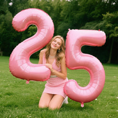 Kelfuoya 40-inch pink foil balloon backdrop adds dramatic party focal point.