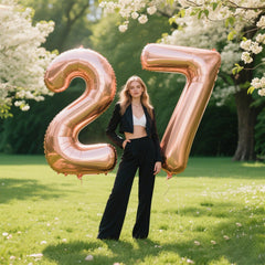 Kelfuoya rose gold 27 balloon backdrop for a photobooth moment.