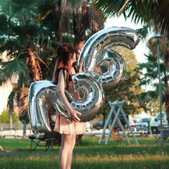 Kelfuoya shimmering number 26 balloon creates a radiant focal point at parties.