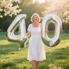 Kelfuoya silver number 14 balloon used as an elegant backdrop for events.
