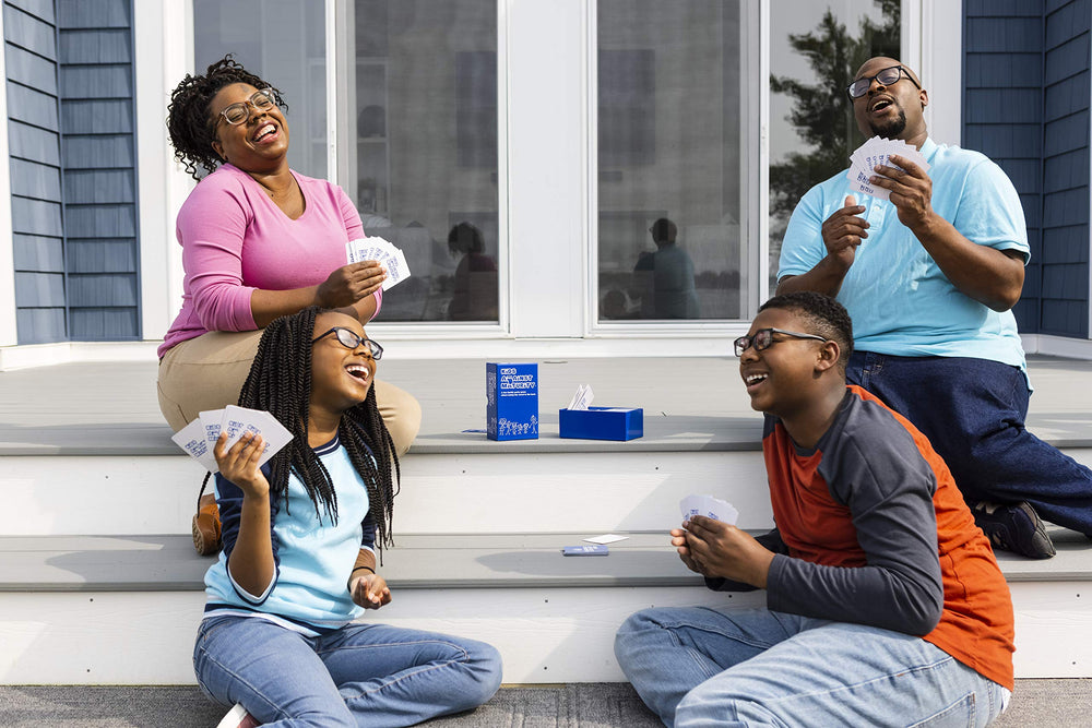 Family game night scene showing smiles and laughter with the game