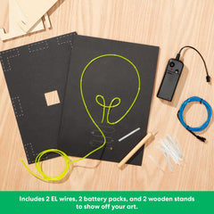 KiwiCo Light-Up Wire Art Kit battery packs power two neon signs for portable use.