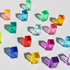 KOAICS Rainbow Crystal Strip Blocks glow under light for shadow play on a light table