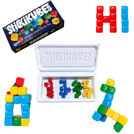 KOMARC GAMES StickiKubes blocks on wall enable versatile, mess-free creativity.