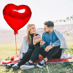 Kortes petals and heart balloons create soft romantic vibe