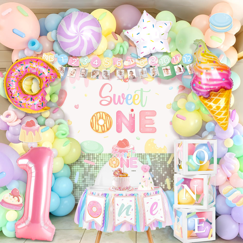 Kriyokiaa Sweet One kit backdrop for vibrant baby girl's first birthday photos.