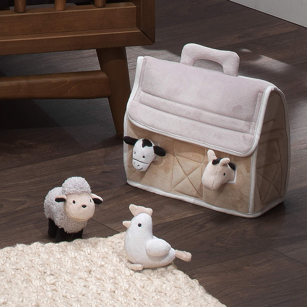 Lambs & Ivy plush barn cow toy supports color recognition and pretend farming.