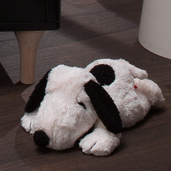 Lambs & Ivy Snoopy lies on tummy, inviting gentle cuddle sessions.